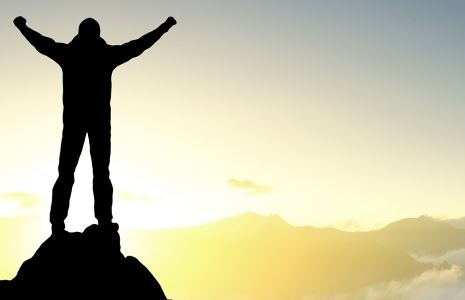 Man on the Top of a Mountain Looking at the Son